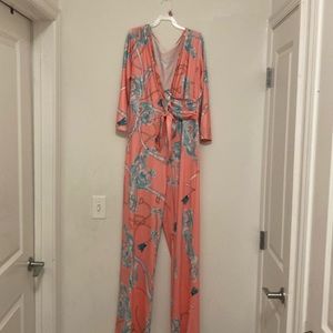 Pink printed Jumpsuit with tie around belt.